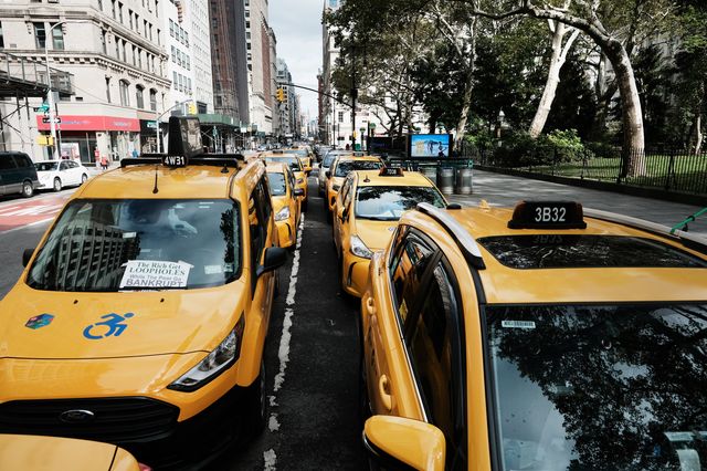 Taxis line the street in Manhattan.